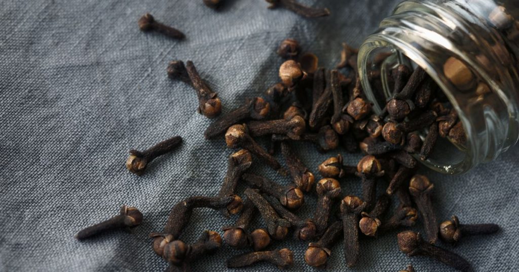 A glass jar filled with cloves, highlighting its antioxidant-rich nature