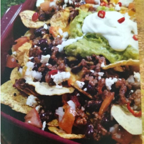 loaded nachos, ultimate nachos, zesty cheese, crispy chips, savory meats, fresh toppings, party snack, game night, shareable nachos, flavor explosion